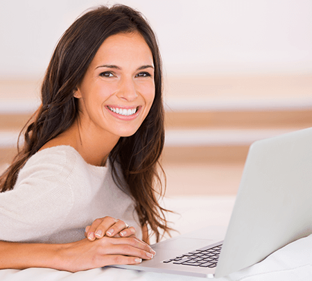 happy woman with her computer